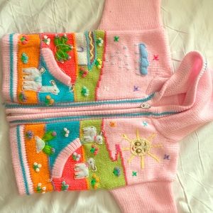 Very cute, hand made cardigan. Fits a 2T